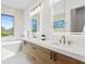 Contemporary main bathroom featuring double vanity, soaking tub, and stylish fixtures at 2554 Arlington St, Sarasota, FL 34239