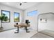 Bright home office with modern desk, large windows, and stylish decor for a productive workspace at 2554 Arlington St, Sarasota, FL 34239
