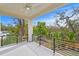 Covered outdoor patio featuring a ceiling fan and views of the lush landscaping at 2554 Arlington St, Sarasota, FL 34239