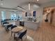 Community cafe with a coffee bar and seating, providing a social hub at 26017 Seastone Dr, Englewood, FL 34223
