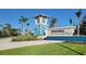 Beachwalk by Manasota Key community entrance with blue tower, landscaping, and community sign at 26017 Seastone Dr, Englewood, FL 34223