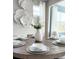 Dining room with a round table, seating for six, and decorative wall art at 26017 Seastone Dr, Englewood, FL 34223