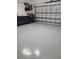 Garage featuring a sealed concrete floor and storage at 26017 Seastone Dr, Englewood, FL 34223