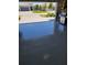 Clean garage featuring epoxy flooring and a view of the neighborhood at 26017 Seastone Dr, Englewood, FL 34223