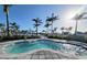 Inviting hot tub surrounded by lush greenery and lounge seating, creating a relaxing outdoor retreat at 26017 Seastone Dr, Englewood, FL 34223