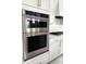 Built-in stainless steel oven and microwave combination in a modern kitchen at 26017 Seastone Dr, Englewood, FL 34223