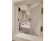 Laundry area featuring a washer, dryer, and shelving at 26017 Seastone Dr, Englewood, FL 34223