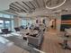 Stylish lounge area with modern furnishings, plenty of seating and natural light at 26017 Seastone Dr, Englewood, FL 34223
