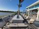 Inviting outdoor firepit area with comfortable seating, perfect for enjoying evenings with water view at 26017 Seastone Dr, Englewood, FL 34223