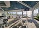 Elegant outdoor dining area by the water, offering a picturesque setting for meals and gatherings at 26017 Seastone Dr, Englewood, FL 34223