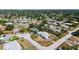 Aerial view showcasing the property within a lush, established neighborhood at 2702 Bedford Way, Sarasota, FL 34239