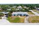 Aerial view of the neighborhood showing a single-story home with a circular driveway at 2702 Bedford Way, Sarasota, FL 34239