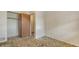 Bedroom with a closet and a door leading to the hallway at 2702 Bedford Way, Sarasota, FL 34239