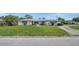 Charming single-story home with a well-maintained lawn and classic curb appeal at 2702 Bedford Way, Sarasota, FL 34239