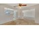 Bright living space offers a view into the kitchen, creating an open and inviting atmosphere at 2702 Bedford Way, Sarasota, FL 34239