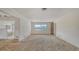 Open living space ready for customization, connecting seamlessly to other rooms at 2702 Bedford Way, Sarasota, FL 34239
