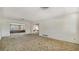 Spacious living room with neutral carpet, offering a blank canvas for new homeowners at 2702 Bedford Way, Sarasota, FL 34239