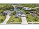 Aerial view of the home with a well-manicured lawn and surrounded by water at 3015 160Th E Ter, Parrish, FL 34219