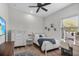 Bright bedroom with a bed, white furniture, accent rug, and a vanity with Hollywood-style lights at 3015 160Th E Ter, Parrish, FL 34219