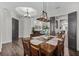 Open concept dining room featuring wooden table, pendant lighting and flow into living spaces at 3015 160Th E Ter, Parrish, FL 34219