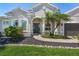 Inviting front entrance with well-maintained landscaping and a covered entryway at 3015 160Th E Ter, Parrish, FL 34219