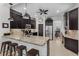 Spacious kitchen featuring a large island, dark cabinets, and stainless steel appliances at 3015 160Th E Ter, Parrish, FL 34219