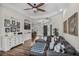Inviting living room with a comfortable sectional sofa and seamless flow into the dining area at 3015 160Th E Ter, Parrish, FL 34219