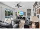 Relaxing living room with comfortable seating and a view of the pool through sliding glass doors at 3015 160Th E Ter, Parrish, FL 34219