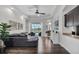 Bright living room featuring a view of the pool, stylish decor, and an open floor plan at 3015 160Th E Ter, Parrish, FL 34219