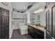 Well-lit bathroom with double vanity, soaking tub, and tiled floors at 3015 160Th E Ter, Parrish, FL 34219