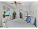 Cozy main bedroom with neutral walls, a ceiling fan, and a king-size bed at 3015 160Th E Ter, Parrish, FL 34219