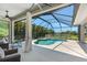 The enclosed pool area with a beautiful pool and lake view at 3015 160Th E Ter, Parrish, FL 34219