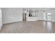 Bright, spacious living room featuring tile floors, ceiling fan, and neutral-colored walls at 3204 Pericles Ave, North Port, FL 34286