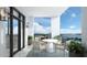 Charming balcony with outdoor seating offering scenic water views and potted greenery at 33 S Palm Ave # 1501, Sarasota, FL 34236