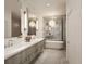 Modern bathroom with dual sinks, a soaking tub, and stylish fixtures and lighting at 33 S Palm Ave # 1501, Sarasota, FL 34236