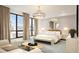 Serene bedroom with a decorative mirror, chandelier lighting and a neutral color palette at 33 S Palm Ave # 1501, Sarasota, FL 34236