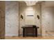 Entryway featuring unique wallpaper, modern art, and a sleek black table with minimalist decor at 33 S Palm Ave # 1501, Sarasota, FL 34236