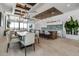 An eat-in kitchen area with stylish chairs, pendant lights, and a large table for communal dining at 33 S Palm Ave # 1501, Sarasota, FL 34236