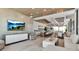 A kitchenette with barstool seating and easy access to the dining area and TV at 33 S Palm Ave # 1501, Sarasota, FL 34236