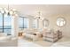 Bright living room featuring floor-to-ceiling windows with ocean views and stylish modern decor at 33 S Palm Ave # 1501, Sarasota, FL 34236