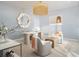 Bright home office with a decorative mirror, modern furnishings, and a serene color scheme at 33 S Palm Ave # 1501, Sarasota, FL 34236