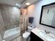 Clean bathroom with a tiled shower/tub combo, updated vanity, and neutral decor at 3473 Clark Rd # 171, Sarasota, FL 34231