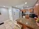 Functional kitchen with stainless steel appliances and a breakfast bar for casual dining at 3473 Clark Rd # 171, Sarasota, FL 34231