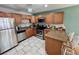 Well-equipped kitchen featuring stainless steel appliances and granite countertops at 3473 Clark Rd # 171, Sarasota, FL 34231