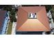 A unique, light brown metal roof of a home with a pool; AC units are visible on the roof at 3701 5Th Ave # 1, Holmes Beach, FL 34217