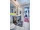 Modern bathroom features stylish vanity with decorative baskets and views to the bedroom at 3701 5Th Ave # 1, Holmes Beach, FL 34217