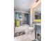Modern bathroom showcasing a shower-over-tub with glass screen, contemporary fixtures, and neutral color palette at 3701 5Th Ave # 1, Holmes Beach, FL 34217