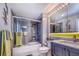 Modern bathroom showcasing a shower-over-tub with glass screen, contemporary fixtures, and neutral color palette at 3701 5Th Ave # 1, Holmes Beach, FL 34217