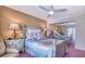 Cozy bedroom with a comfortable bed, side tables with lamps, and mirrored closet at 3701 5Th Ave # 1, Holmes Beach, FL 34217