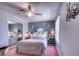 Cozy bedroom features soft lighting, decorative wall art, and a mirrored closet at 3701 5Th Ave # 1, Holmes Beach, FL 34217